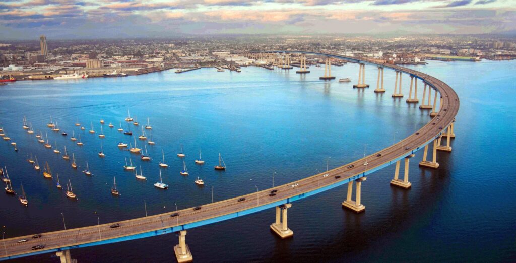 Aerial view of the Coronado Bridge curving over San Diego Bay